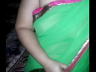 Shonali clad cramped to green sari